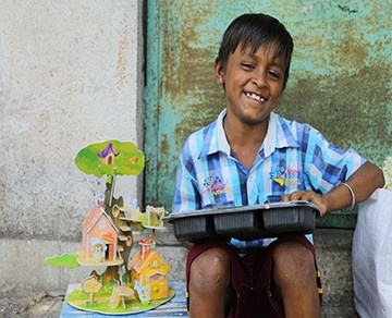 Smiling child receiving food support